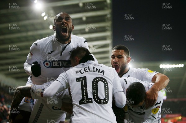 151218 - Swansea City v Sheffield Wednesday - SkyBet Championship - Wayne Routledge of Swansea City celebrates scoring a goal with team mates with Leroy Fer cheering towards the fans