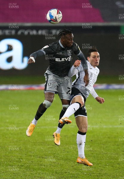 251120 - Swansea City v Sheffield Wednesday, Sky Bet Championship - Moses Odubajo of Sheffield Wednesday and Connor Roberts of Swansea City compete for the ball