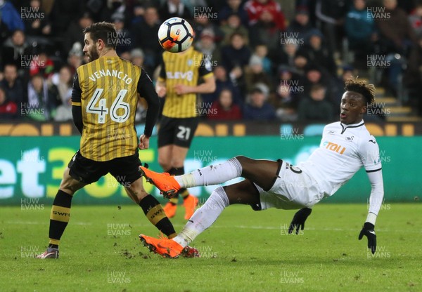 270218 - Swansea City v Sheffield Wednesday, FA Cup Fifth Round Replay - Tammy Abraham of Swansea City and Frederico Venancio of Sheffield Wednesday compete for the ball