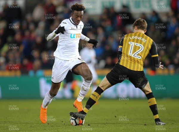 270218 - Swansea City v Sheffield Wednesday, FA Cup Fifth Round Replay - Tammy Abraham of Swansea City takes on Glenn Loovens of Sheffield Wednesday