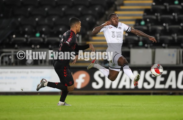 080122 - Swansea City v Southampton, FA Cup - Michael Obafemi of Swansea City is challenged by Yan Valery of Southampton resulting in Valery being shown a red card