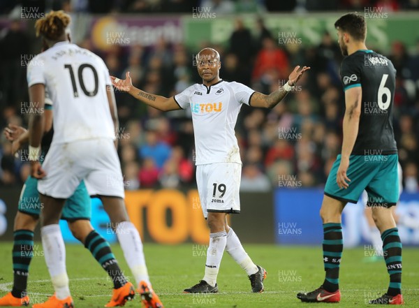 080518 - Swansea City v Southampton, Premier League - Andre Ayew of Swansea City reacts at Tammy Abraham of Swansea City after he fails to make the ball available for a shot at goal