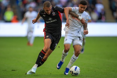 180426 - Swansea City v Southampton - Sky Bet Championship - Gustavo Nunes of Swansea City battles for the ball with Nathan Wood of Southampton