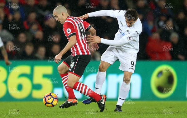 310117 - Swansea City v Southampton - Premier League - Fernando Llorente of Swansea City is tackled by Oriol Romeu of Southampton