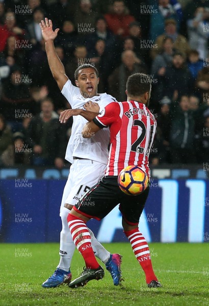 310117 - Swansea City v Southampton - Premier League - Wayne Routledge of Swansea City is blocked by Cedric Soares of Southampton