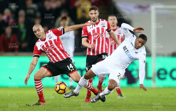 310117 - Swansea City v Southampton - Premier League - Luciano Narsingh of Swansea City is tackled by Oriol Romeu of Southampton