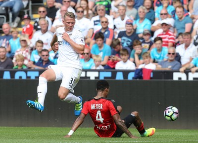 060816 -  Swansea City v Stade Rennais, Pre-season Friendly - Stephen Kingsley of Swansea City is tackled by Pedro Mendes of Stade Rennais