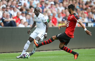 060816 -  Swansea City v Stade Rennais, Pre-season Friendly - Modou Barrow of Swansea City is challenged by Pedro Mendes of Stade Rennais