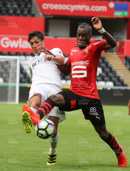 060816 -  Swansea City v Stade Rennais, Pre-season Friendly - Jack Cork of Swansea City and Yacouba Sylla of Stade Rennais compete to win the ball