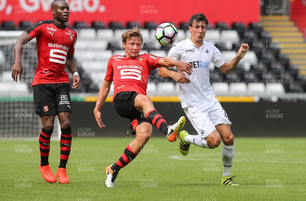 060816 -  Swansea City v Stade Rennais, Pre-season Friendly - Jack Cork of Swansea City and Clement Chantome of Stade Rennais compete for the ball