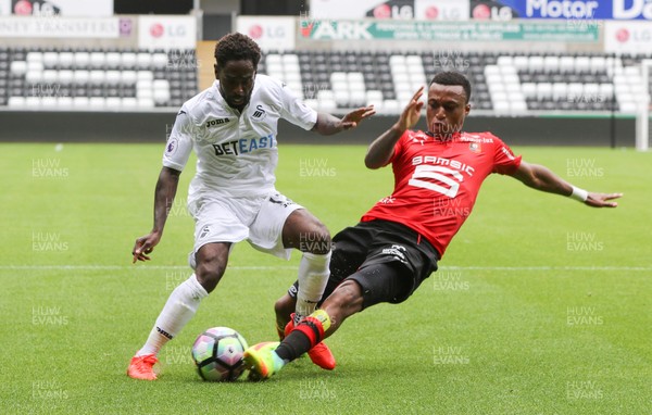 060816 -  Swansea City v Stade Rennais, Pre-season Friendly - Nathan Dyer of Swansea City is challenged by Edson Mexer of Stade Rennais