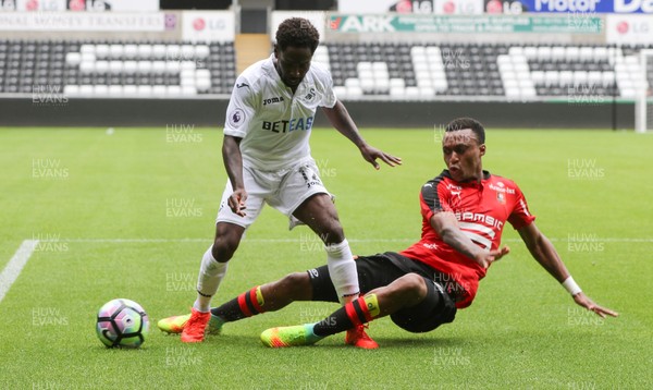 060816 -  Swansea City v Stade Rennais, Pre-season Friendly - Nathan Dyer of Swansea City is challenged by Edson Mexer of Stade Rennais