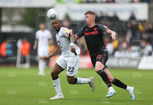 051019 - Swansea City v Stoke City, SkyBet Championship - Andre Ayew of Swansea City and Sam Clucas of Stoke City compete for the ball