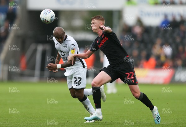 051019 - Swansea City v Stoke City, SkyBet Championship - Andre Ayew of Swansea City and Sam Clucas of Stoke City compete for the ball
