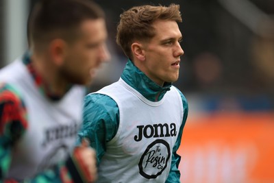 070326 - Swansea City v Stoke City - Sky Bet Championship - Ethan Galbraith of Swansea City warming up before game