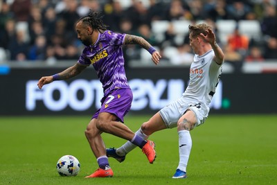 070326 - Swansea City v Stoke City - Sky Bet Championship - Sorba Thomas of Stoke City is tackled by Ethan Galbraith of Swansea City
