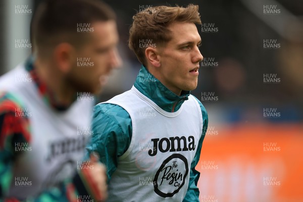 070326 - Swansea City v Stoke City - Sky Bet Championship - Ethan Galbraith of Swansea City warming up before game