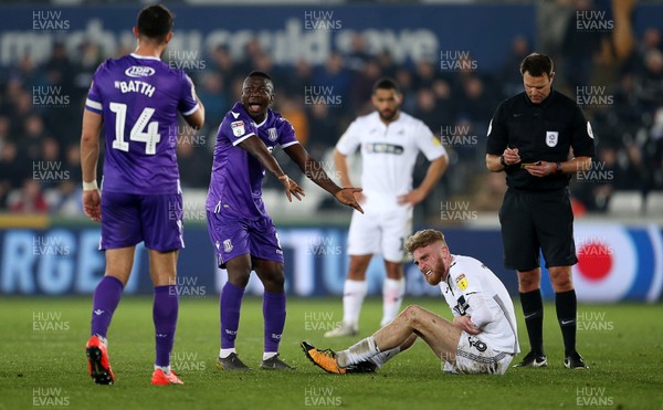 090419 - Swansea City v Stoke City - SkyBet Championship - Oghenekaro Etebo of Stoke City reacts after been given a yellow card for his tackle on Oli McBurnie of Swansea City