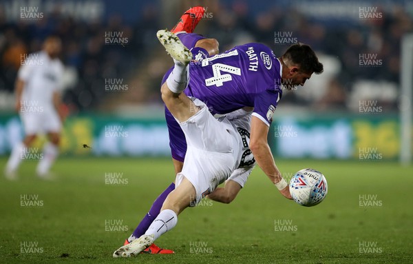 090419 - Swansea City v Stoke City - SkyBet Championship - Daniel James of Swansea City collides with Danny Batth of Stoke City