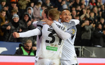 100424 - Swansea City v Stoke City - Sky Bet Championship - Swansea City teammates celebrates scoring the first goal