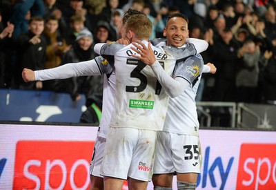 100424 - Swansea City v Stoke City - Sky Bet Championship - Swansea City teammates celebrates scoring the first goal