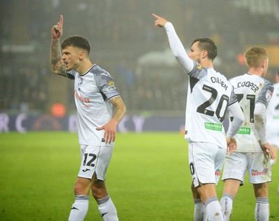 100424 - Swansea City v Stoke City - Sky Bet Championship -  Jamie Paterson of Swansea City celebrates scoring a goal with Liam Cullen