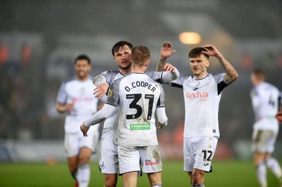 100424 - Swansea City v Stoke City - Sky Bet Championship - Swansea players celebrate winning a penalty