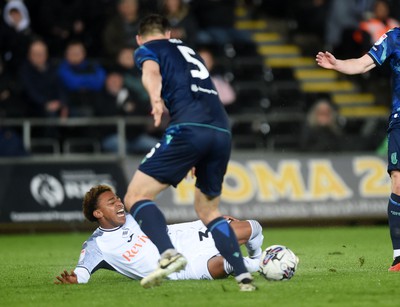 100424 - Swansea City v Stoke City - Sky Bet Championship - Aimar Govea of Swansea City is challenged by Michael Rose of Stoke City 