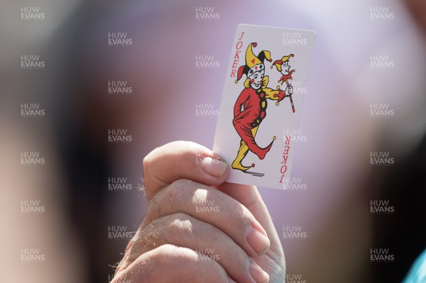 130518 - Swansea City v Stoke City, Premier League - A protester shows playing cards indicating his view of the situation Swansea City find themselves in during a protest outside the Liberty Stadium as Swansea City prepare to take on Stoke City in the final Premier League match of the season