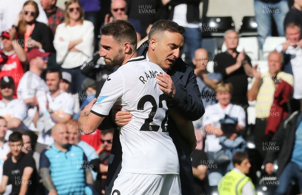 130518 - Swansea City v Stoke City, Premier League - Swansea City manager Carlos Carvalhal with Angel Rangel of Swansea City at the end of the match as Swansea City are relegated from the Premier League