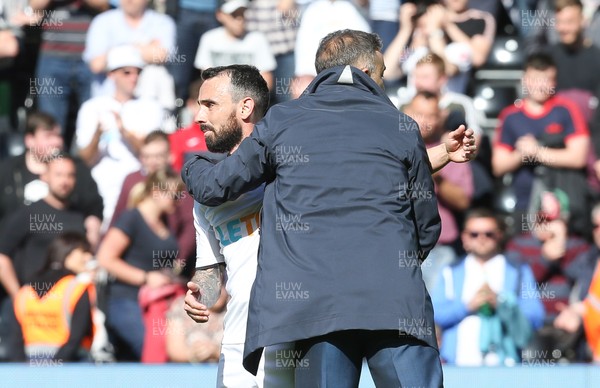 130518 - Swansea City v Stoke City, Premier League - Swansea City manager Carlos Carvalhal with Leon Britton of Swansea City at the end of the match as Swansea City are relegated from the Premier League