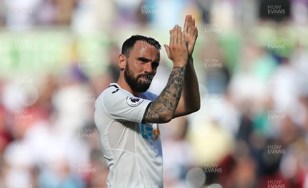 130518 - Swansea City v Stoke City, Premier League - Leon Britton of Swansea City applauds the fans at the end of the match as Swansea City are relegated from the Premier League