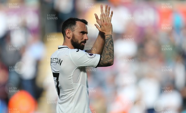 130518 - Swansea City v Stoke City, Premier League - Leon Britton of Swansea City applauds the fans at the end of the match as Swansea City are relegated from the Premier League