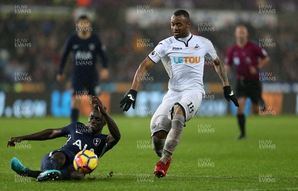 020118 - Swansea City v Tottenham Hotspur - Premier League - Jordan Ayew of Swansea City is tackled by Davinson Sanchez of Tottenham Hotspur
