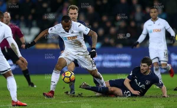 020118 - Swansea City v Tottenham Hotspur - Premier League - Jordan Ayew of Swansea City is tackled by Ben Davies of Tottenham Hotspur and misses a shot at goal