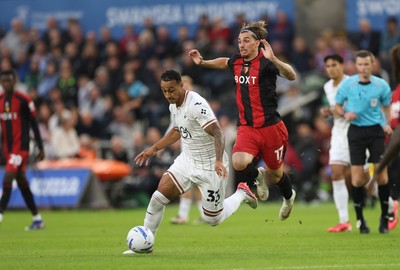 010926 Swansea City v Watford, EFL Sky Bet Championship - Adam Idah of Swansea City takes on Iker Bravo of Watford