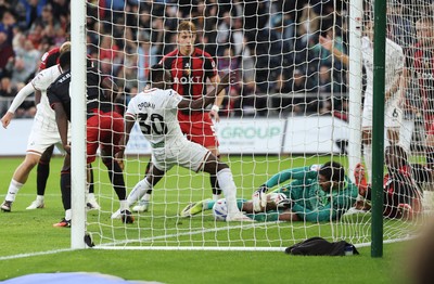 010926 Swansea City v Watford, EFL Sky Bet Championship - Watford goalkeeper Federico Ravaglia saves at the feet of Joseph Opoku of Swansea City