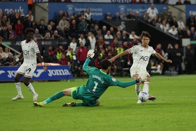 010926 Swansea City v Watford, EFL Sky Bet Championship - Watford goalkeeper Federico Ravaglia saves a shot from Ji-Sung Eom of Swansea City