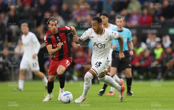 010926 Swansea City v Watford, EFL Sky Bet Championship - Adam Idah of Swansea City takes on Iker Bravo of Watford