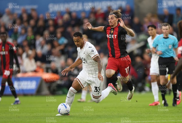 010926 Swansea City v Watford, EFL Sky Bet Championship - Adam Idah of Swansea City takes on Iker Bravo of Watford