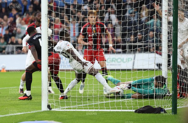 010926 Swansea City v Watford, EFL Sky Bet Championship - Watford goalkeeper Federico Ravaglia saves at the feet of Joseph Opoku of Swansea City
