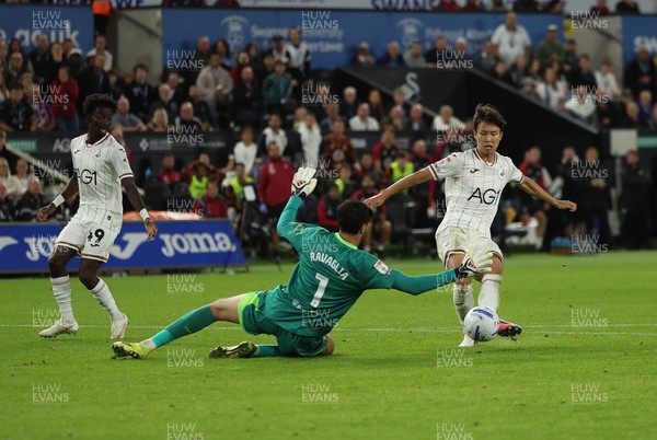 010926 Swansea City v Watford, EFL Sky Bet Championship - Watford goalkeeper Federico Ravaglia saves a shot from Ji-Sung Eom of Swansea City