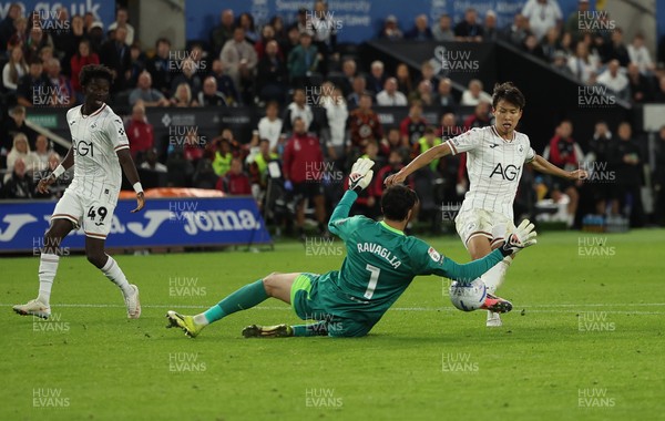010926 Swansea City v Watford, EFL Sky Bet Championship - Watford goalkeeper Federico Ravaglia saves a shot from Ji-Sung Eom of Swansea City