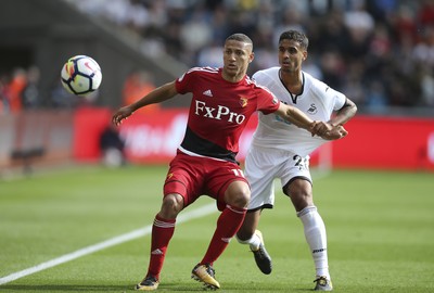 230917 - Swansea City v Watford, Premier League - Richarlison of Watford holds off Kyle Naughton of Swansea City