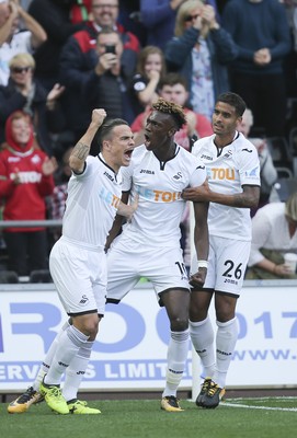 230917 - Swansea City v Watford, Premier League - Tammy Abraham of Swansea City, centre, celebrates with Roque Mesa of Swansea City and Kyle Naughton of Swansea City after scoring goal