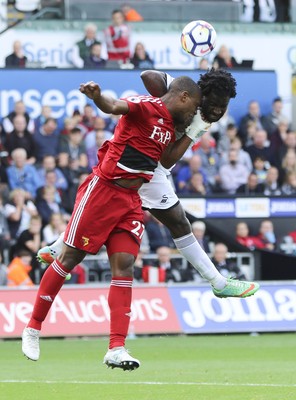 230917 - Swansea City v Watford, Premier League - Wilfried Bony of Swansea City and Christian Kabasele of Watford compete for the ball