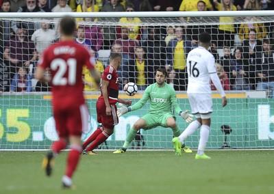 230917 - Swansea City v Watford, Premier League - Richarlison of Watford beats Swansea City goalkeeper Lukasz Fabianski to score Watford's second goal