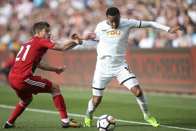 230917 - Swansea City v Watford, Premier League - Martin Olsson of Swansea City gets past Kiko Femenia of Watford