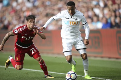 230917 - Swansea City v Watford, Premier League - Martin Olsson of Swansea City gets past Kiko Femenia of Watford