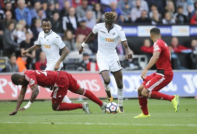 230917 - Swansea City v Watford, Premier League - Tammy Abraham of Swansea City takes on Christian Kabasele of Watford and Adrian Mariappa of Watford